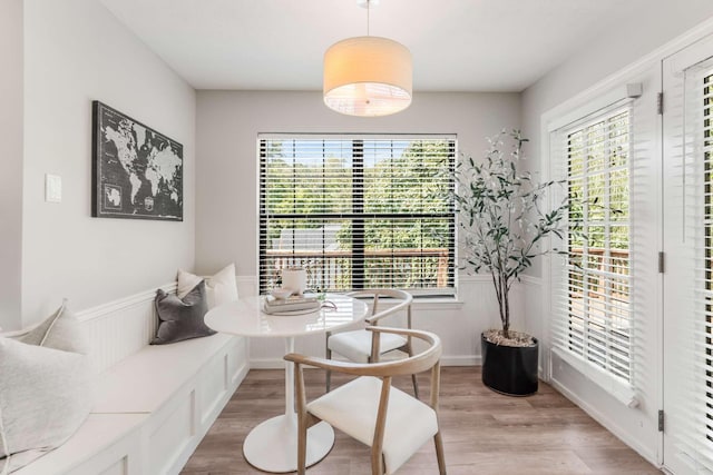 dining space with plenty of natural light and light wood-type flooring