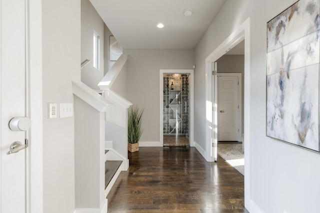 hallway featuring dark wood-type flooring