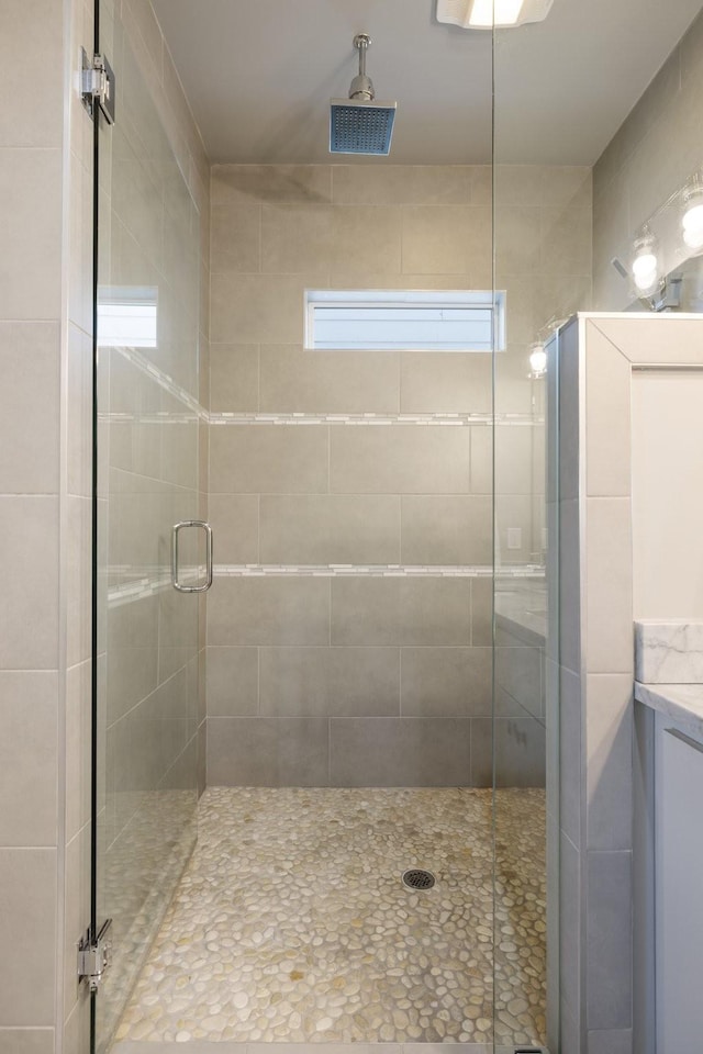 bathroom featuring vanity and walk in shower