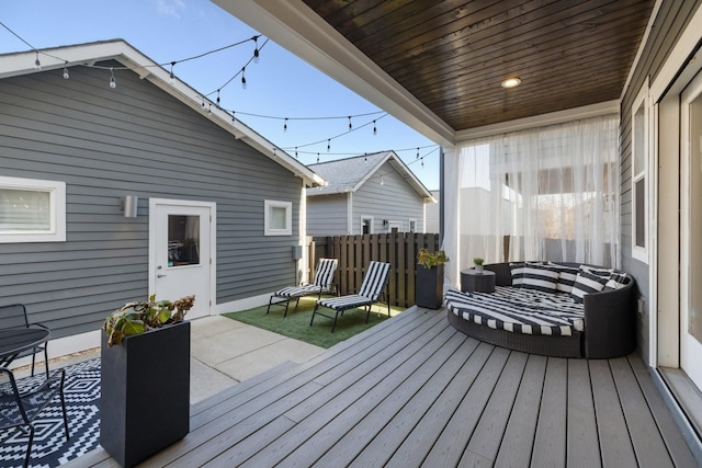 wooden terrace featuring a patio area