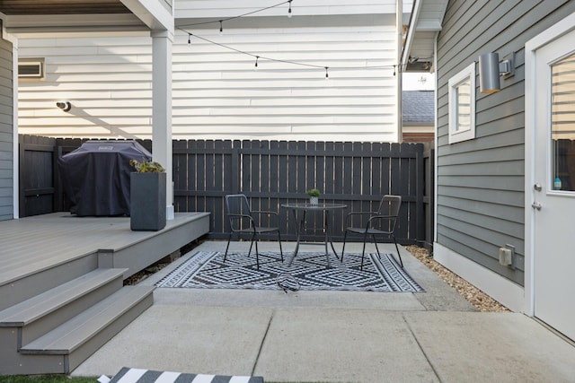 view of patio / terrace featuring grilling area and a deck