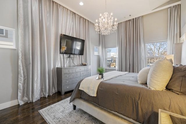 bedroom featuring dark hardwood / wood-style floors and a notable chandelier