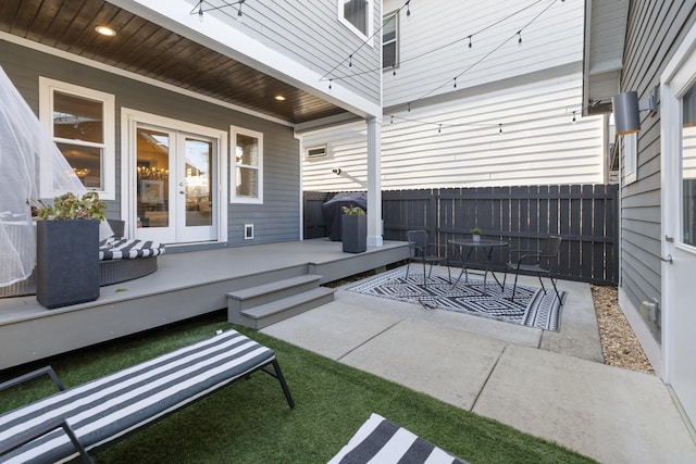 view of patio with a wooden deck and french doors