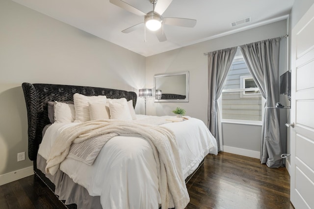 bedroom featuring dark hardwood / wood-style floors and ceiling fan