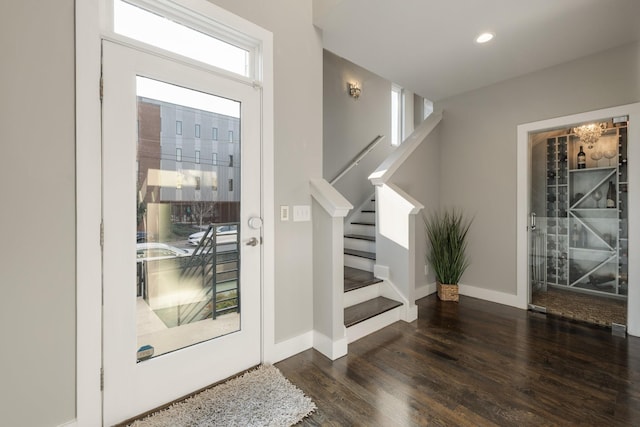 foyer with dark hardwood / wood-style floors