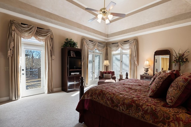 bedroom featuring crown molding, ceiling fan, carpet flooring, a tray ceiling, and access to outside