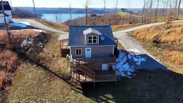 back of property with a deck and cooling unit