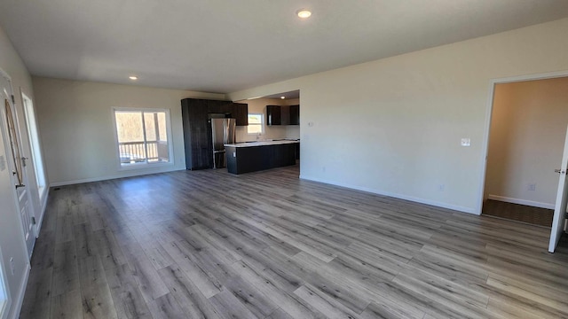 unfurnished living room featuring light hardwood / wood-style floors