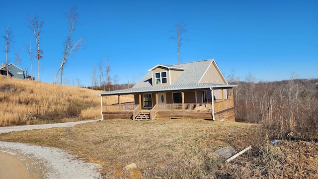 farmhouse-style home featuring covered porch