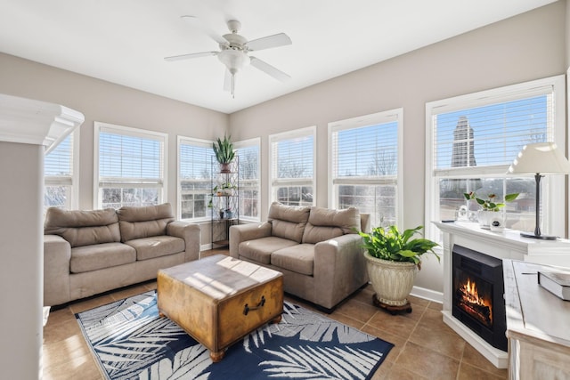 living room with ceiling fan and light tile patterned flooring