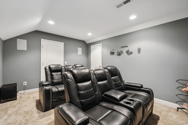 carpeted cinema with lofted ceiling