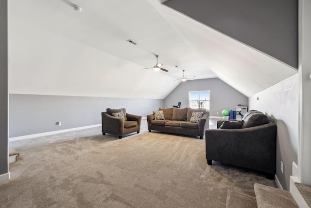 living room with ceiling fan, carpet floors, and lofted ceiling