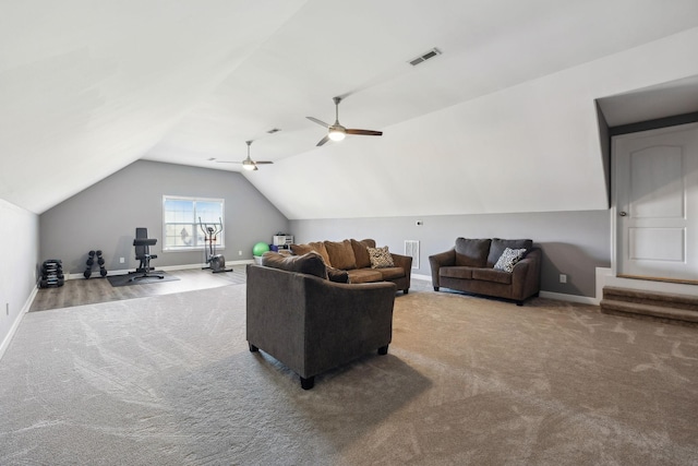 living room featuring ceiling fan, carpet flooring, and vaulted ceiling