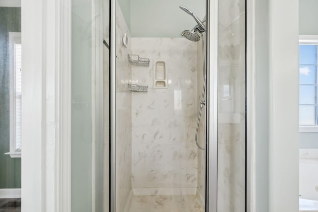 bathroom featuring an enclosed shower