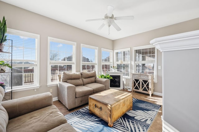 sunroom / solarium with ceiling fan