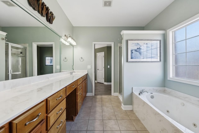 bathroom featuring separate shower and tub, vanity, and tile patterned floors