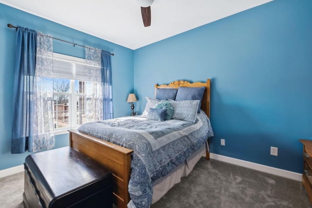 bedroom with ceiling fan and dark colored carpet