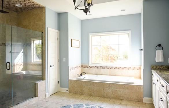 bathroom featuring vanity, a notable chandelier, tile patterned floors, and shower with separate bathtub