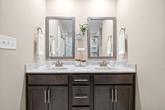 bathroom featuring vanity and an enclosed shower