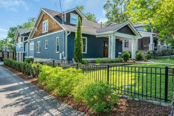 craftsman-style home with a front lawn