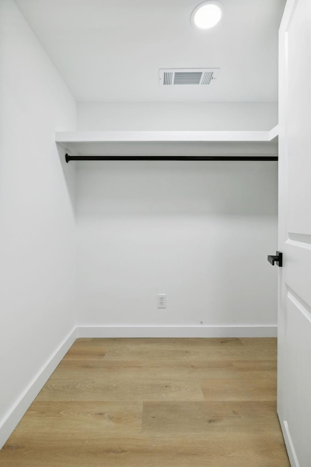 walk in closet featuring light wood-type flooring