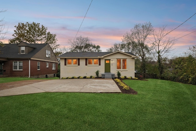 view of front of home with a yard