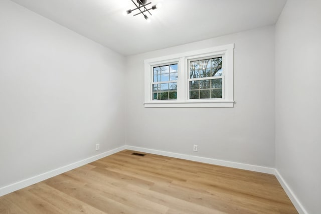 empty room with light wood-type flooring