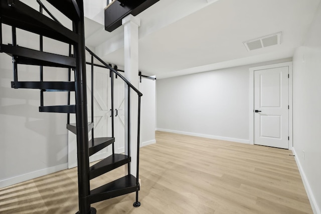 stairway with wood-type flooring