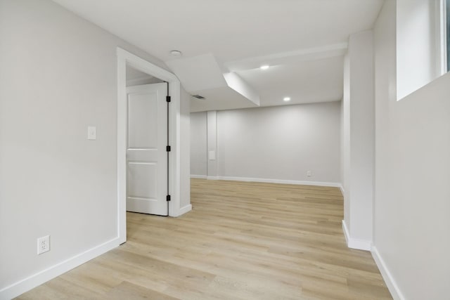 basement featuring light hardwood / wood-style floors