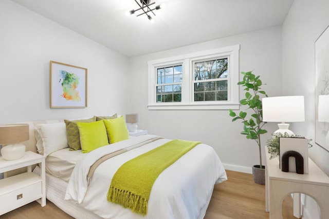 bedroom with hardwood / wood-style floors