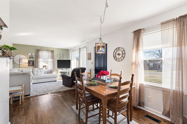 dining room with dark hardwood / wood-style floors