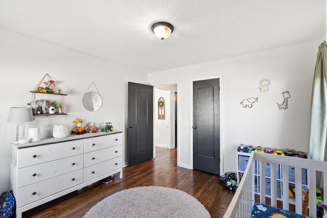 bedroom with dark wood-type flooring