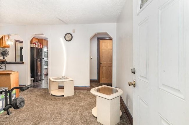 interior space with a textured ceiling