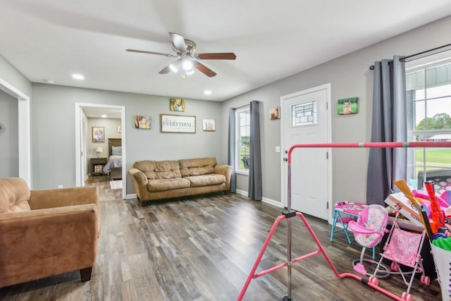 game room featuring ceiling fan and dark hardwood / wood-style floors