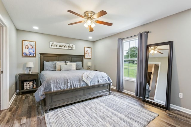 bedroom featuring hardwood / wood-style flooring and ceiling fan