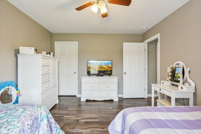 bedroom featuring ceiling fan and dark hardwood / wood-style floors