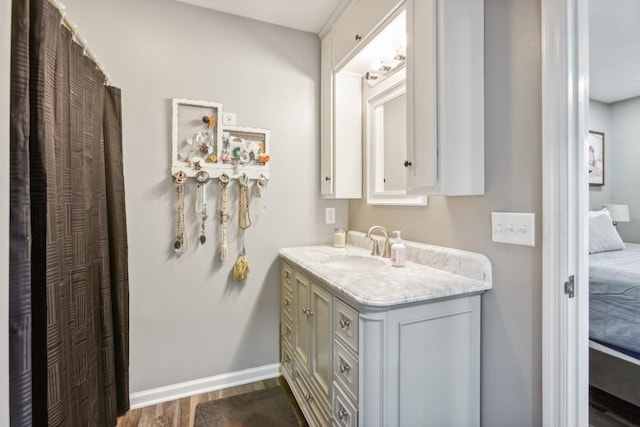 bathroom with vanity and wood-type flooring