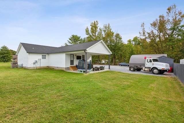 rear view of house with a lawn