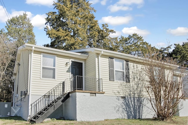 view of front of property with central air condition unit