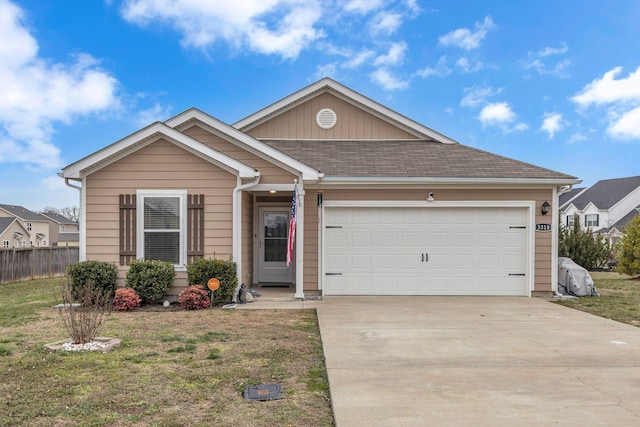 view of front of home featuring a garage and a front yard