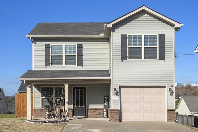 view of front of home with covered porch and a garage