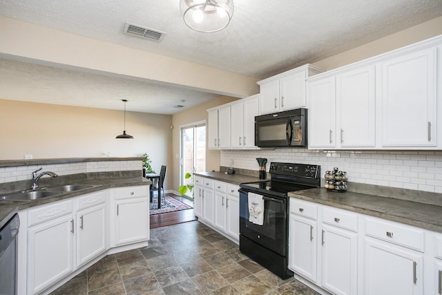 kitchen with pendant lighting, sink, white cabinets, and black appliances