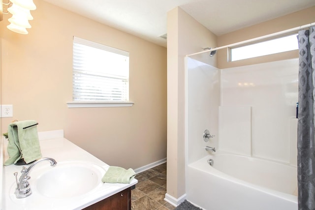 bathroom featuring vanity and shower / bath combo