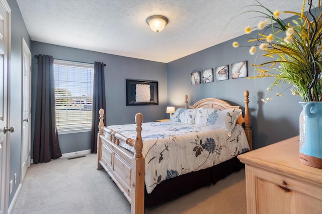 bedroom featuring light carpet