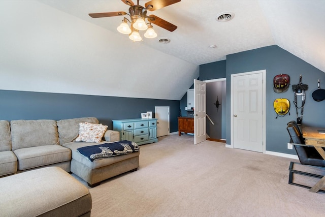 carpeted living room featuring vaulted ceiling and ceiling fan