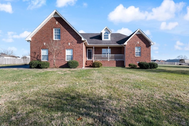 view of property with a porch and a front yard