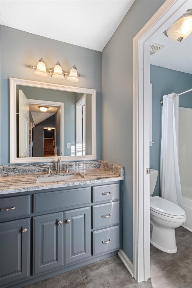 full bathroom featuring toilet, vanity, and shower / bath combination with curtain