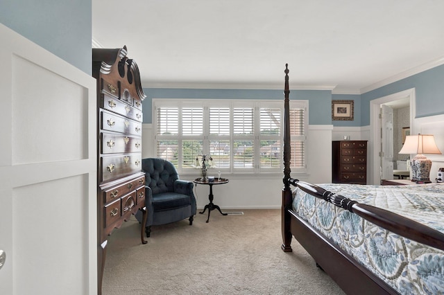 carpeted bedroom featuring crown molding