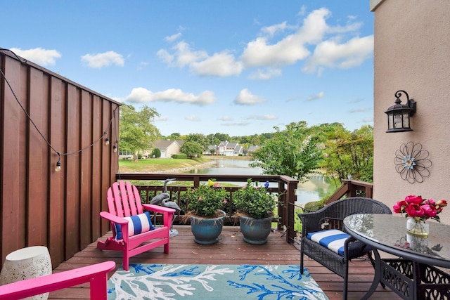 balcony featuring a water view