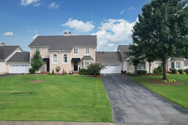 view of front facade featuring a garage and a front lawn